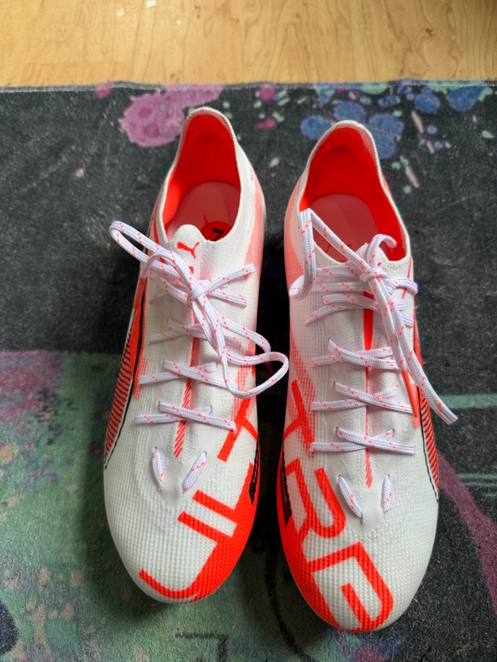 Puma White and Bright Orange Soccer Cleats